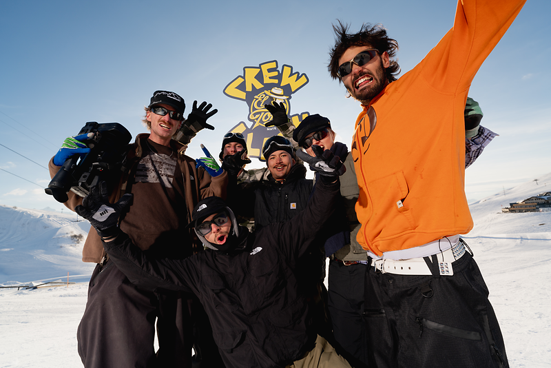 Group of friends on the slopes celebrating with El Tony Mate beverage.